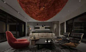 A contemporary living room featuring a textured metallic ceiling and a bold red accent chair.