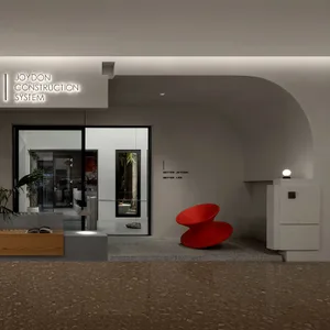 Modern minimalist lobby with white walls, glass doors, a red sculptural chair, and concrete flooring.
