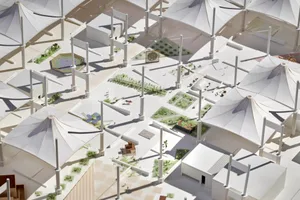 Model of a modern urban campus featuring white roofed tents arranged in a grid pattern.