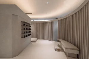Modern retail space with granite walls and seating area