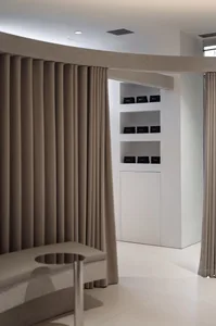 A minimalist spa interior with white stone curtains and modern design elements.