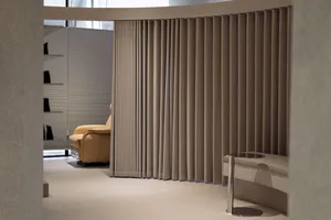 A modern interior design featuring space-divider curtains made of fabric.