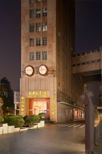 A modern commercial building with a brick exterior at night.