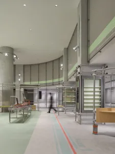 A modern retail store interior with metal fixtures, glass displays, and concrete flooring.