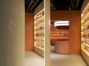 A modern bookstore with warm-toned materials and well-lit shelves.
