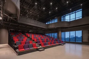 A modern conference room featuring metal and fabric elements.