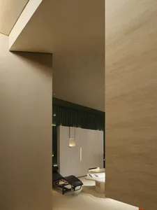 Modern minimalist spa interior with concrete walls and lighting accents.