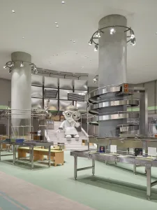 An industrial retail space featuring a large conveyor belt and metallic structural elements.