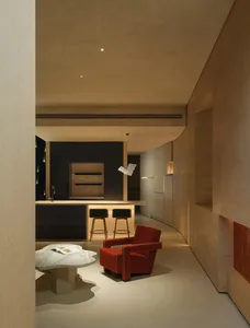 Minimalist living room with marble floor and concrete walls