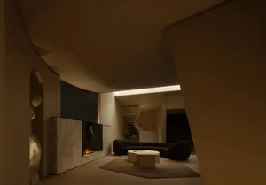 An industrial-style living room with concrete walls, marble tiles, and a fireplace.
