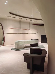 Modern commercial interior featuring minimalist design with concrete materials.