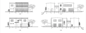 Modern facade with large glass windows and architectural design.
