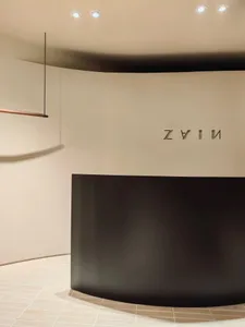 A modern reception desk with a metal frame.