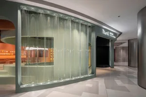 A modern commercial space with a glass wall