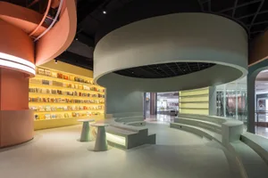 A minimalist retail storefront with glass and concrete materials.