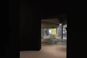 A modern exhibition space featuring mixed-media design elements.