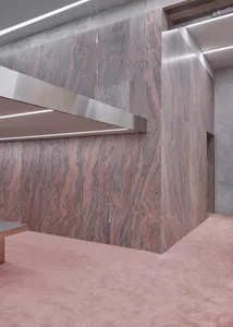 Modern office lobby featuring granite flooring and minimalist design elements.