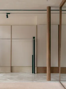 A minimalist interior space featuring modern lighting fixtures and furniture.