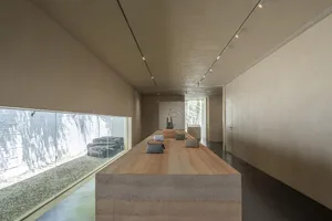 A minimalist retail space featuring a concrete countertop.
