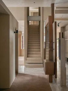 Modern interior design featuring marble and wood elements.
