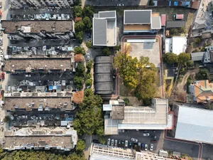 A modern office building with a concrete floor plan viewed from above.