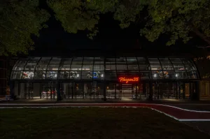 Modern retail store with glass walls at night