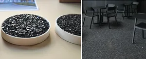 Black metal chairs and tables set on metallic floor.