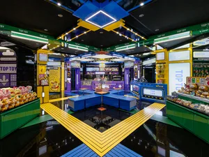 A modern retail store with a vibrant color scheme featuring plastic and metal elements.