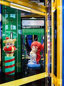A colorful toy store display featuring plastic figurines and vibrant materials.