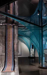 An industrial design installation featuring a teal textile installation