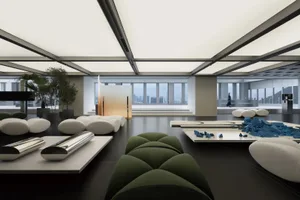 A modern office space featuring industrial design elements with metal, glass, and concrete materials.