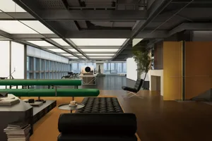 現代辦公室空間，搭配黑色與綠色家具。