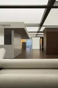Modern office space featuring glass, metal, and wood materials.