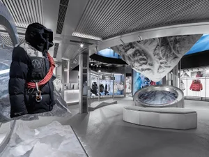 An industrial-themed retail shop featuring glass elements and a modern design.