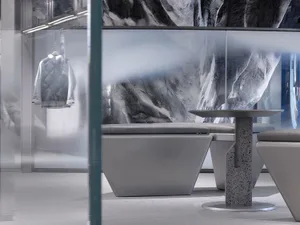 A modern commercial interior space featuring concrete elements and a minimalist design.