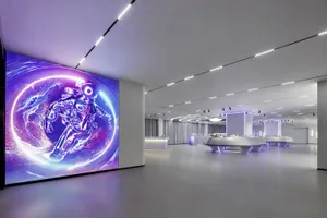 An expansive, futuristic-looking corporate event space featuring an LED wall display of an astronaut in space