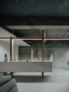 Modern kitchen with concrete walls and minimalist design.