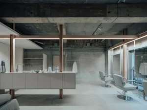 Modern living room with minimalist furniture and concrete walls