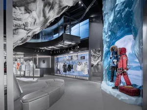 A modern retail storefront featuring a metallic countertop and ice-themed design elements.