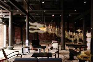 Industrial style lobby with wooden, metal, and plaster elements