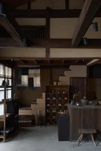 A minimalist retail interior with wooden structures and a cozy atmosphere.