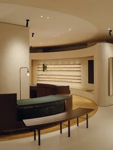 Minimalist retail store showcasing wood, metal, and ceramic-tiled features