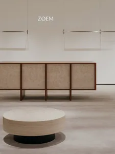 Modern retail store with minimalist design featuring marble and brass elements