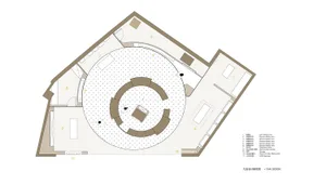 A floor plan of a spiral-shaped architectural space with a central round area surrounded by unique rooms.