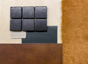 Various material samples including tiles, leather, fabric, and wood.