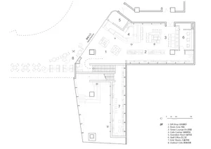 A detailed 2D plan of an office space, showing various functional areas and layouts.
