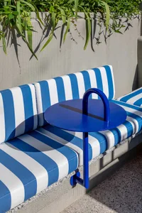 Blue and white striped cushions in a retail setting