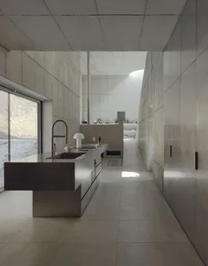 A contemporary kitchen with minimalist design and concrete finishes