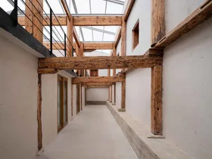 Industrial-style interior design featuring wooden beams and beams