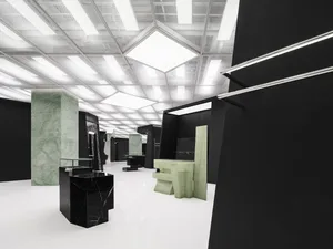 A minimalist furniture display featuring marble elements.